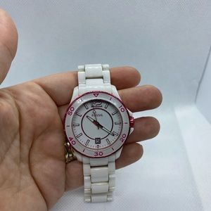 White acrylic Fossil watch with pink accents.